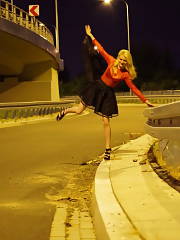 Leggy Light Haired In Sheer Top & Miniskirt Posing Outdoors