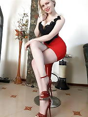 Cool Curvy Light Haired Girl Posing In Red Tight Mini Skirt And High Heeled Sandals