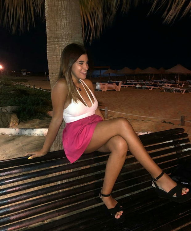 Leggy Chick In Pink Flared Miniskirt And Clevy Top