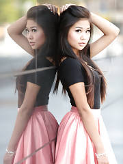 Sweet Asian In A Black Top And Pink Skirt