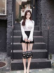 Sweet Asian In A White Blouse And Black Skirt